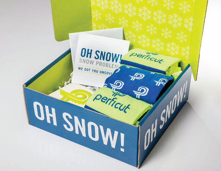 Oh Snow box of Perficut swag included branded socks created by Project7 Design